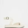 AERE Asymmetrical Buckle Sandals Cream Leather